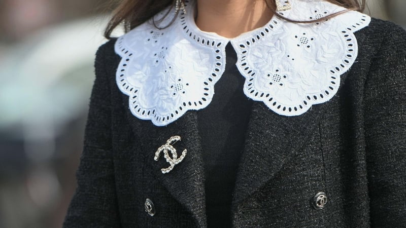 A model wearing a brooch in the Chanel runway show