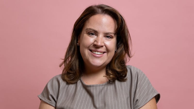 A woman smiling for a photo