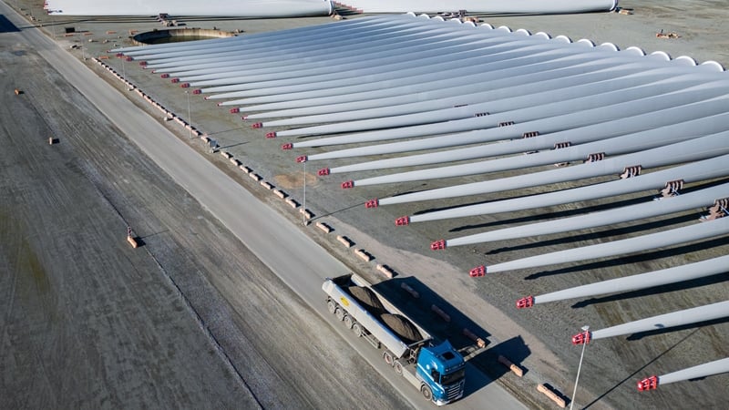 Aerial view of wind turbine blades lying on the ground