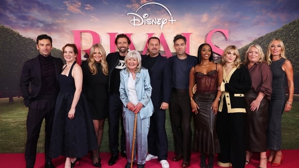 LONDON, ENGLAND - SEPTEMBER 17: (L to R) Aidan Turner, Katherine Parkinson, Emily Atack, David Tennant, Dame Jilly Cooper, Danny Dyer, Alex Hassell, Nafessa Williams, Bella Maclean, Claire Rushbrook and Victoria Smurfit attend a special UK screening of "Rivals" at The Ham Yard Hotel on September 17,