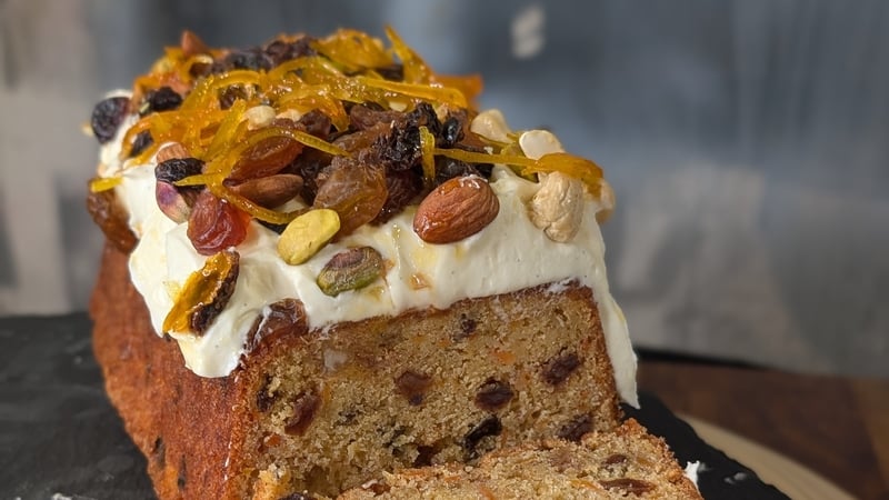 A cake topped with nuts and icing