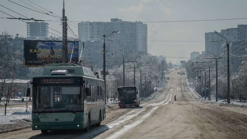 Buses drive down a snow covered road in Kharkiv on February 4, 2026, amid the Russian invasion of Ukraine.