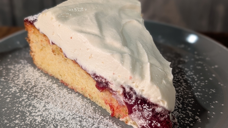 Victoria sponge cake with whipped cream and jam