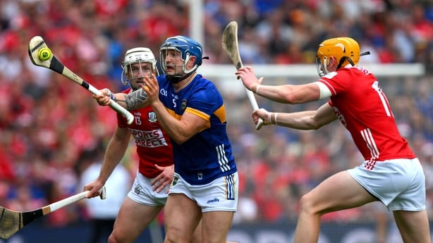 20 July 2025; Willie Connors of Tipperary is tackled by Shane Barrett and Brian Hayes of Cork during the GAA Hurling All-Ireland Senior Championship final match between Cork and Tipperary at Croke Park in Dublin. Photo by Ray McManus/Sportsfile