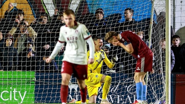 6 February 2026; Drogheda United goalkeeper Luke Dennison celebrates after a penalty by David Hurley of Galway United, right, goes wide during the SSE Airtricity Men's Premier Division match between Galway United and Drogheda United at Eamonn Deacy Park i