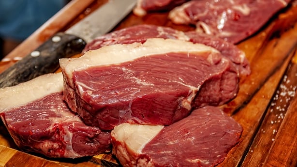 some thick slices of raw sirloin steak