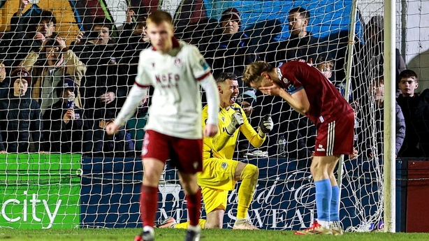 6 February 2026; Drogheda United goalkeeper Luke Dennison celebrates after a penalty by David Hurley of Galway United, right, goes wide during the SSE Airtricity Men's Premier Division match between Galway United and Drogheda United at Eamonn Deacy Park in Galway. Photo by Thomas Flinkow/Sportsfile