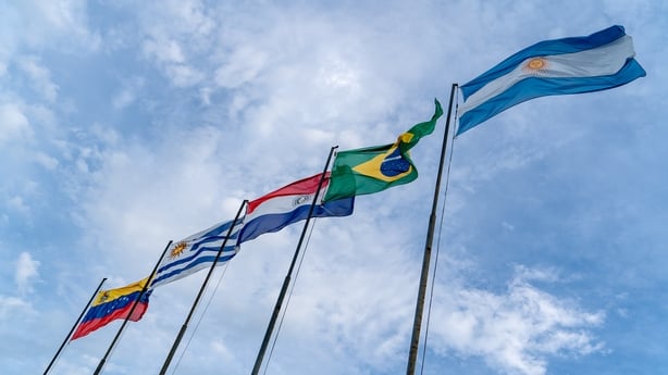 Mercosur flags flying high. Several flagpoles with Mercosur flags. Latin American flags. South American flags.