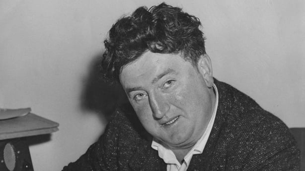 Irish writer Brendan Behan (1923 - 1964) signs a production contract for his play 'The Quare Fellow' at the Comedy Theatre in London, 10th July 1956. (Photo by Reg Burkett/Keystone/Hulton Archive/Getty Images)