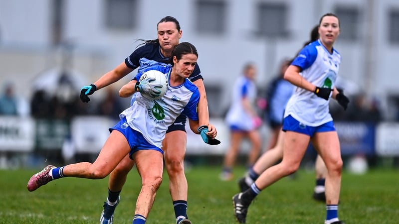 Áine O'Neill of Waterford with the ball against Niamh Hetherton of Dublin - 2026 Lidl NFL Division 1