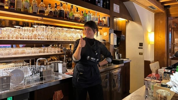 Valentina Galvan works in a bustling cafe on the Main Street