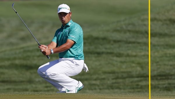 Hideki Matsuyama of Japan reacts after playing a shot onto the second green during the third round of the 2026 Phoenix Open