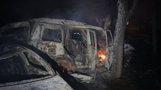 Vehicles burn in the aftermath of Russian destruction caused by two KAB bombs in the city of Kramatorsk