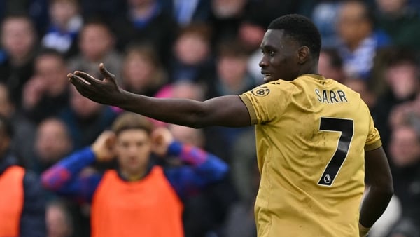 Crystal Palace's Senegalese midfielder #07 Ismaila Sarr (R) celebrates after scoring the opening goal of the English Premier League football match between Brighton and Hove Albion and Crystal Palace at the American Express Community Stadium in Brighton, s