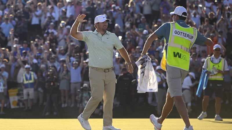 SCOTTSDALE, ARIZONA - FEBRUARY 08: Chris Gotterup of the United States celebrates with his caddie on the 18th green of the first playoff hole after winning the WM Phoenix Open 2026 at TPC Scottsdale on February 08, 2026 in Scottsdale, Arizona. (Photo by A