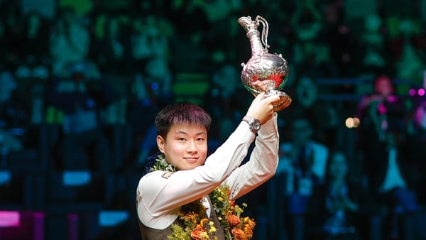 HONG KONG, CHINA - FEBRUARY 08: Zhao Xintong of China poses with champion trophy after winning the Final match against Zhang Anda of China on day 6 of the World Grand Prix 2026 at Kai Tak Arena on February 8, 2026 in Hong Kong, China. (Photo by Tai Chengz