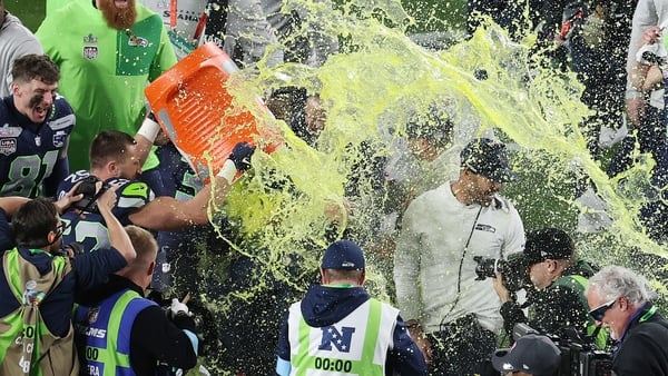 SANTA CLARA, CALIFORNIA - FEBRUARY 08: Head coach Mike MacDonald of the Seattle Seahawks is doused with Gatorade by Patrick O'Connell #52 of the Seattle Seahawks after beating New England Patriots to win Super Bowl LX at Levi's Stadium on February 08, 202