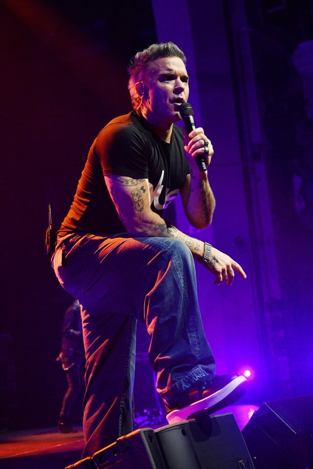 LONDON, ENGLAND - FEBRUARY 08: (EDITORIAL USE ONLY. IMAGES MAY ONLY BE USED IN RELATION TO THE EVENT) Robbie Williams performs onstage during his Long 90's UK Tour at Brixton Academy on February 08, 2026 in London, England. (Photo by Jim Dyson/Getty Images)