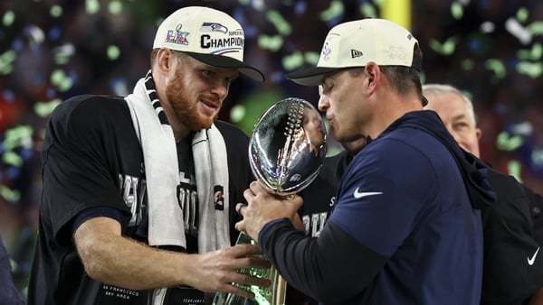 SANTA CLARA, CALIFORNIA - FEBRUARY 8: Mike MacDonald and Sam Darnold #14 of the Seattle Seahawks lift the Vince Lombardi Trophy after the NFL Super Bowl LX football game against the New England Patriots, at Levi's Stadium on February 8, 2026 in Santa Clar