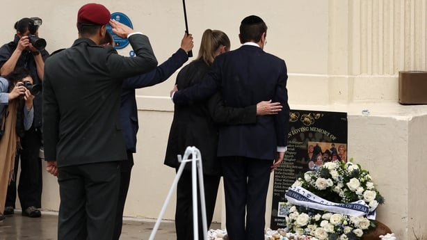 Israeli President Isaac Herzog and his wife Michal lay a wreath 