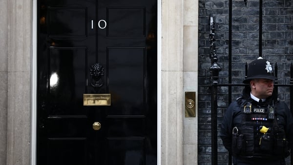 A police officer stands on duty outside 10 Downing Street