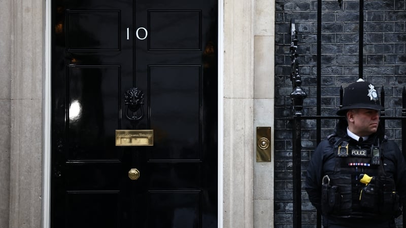 A police officer stands on duty outside 10 Downing Street