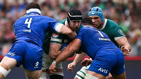 Ireland captain Caelan Doris is tackled by Italy's Dino Lamb, left, and Danilo Fischetti during last year's Six Nations encounter