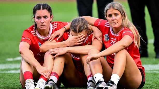 Laura Hayes, centre, is consoled by Cork team-mates Saoirse McCarthy, left, and Ciara O'Sullivan, right, after last year's All-Ireland final defeat to Galway