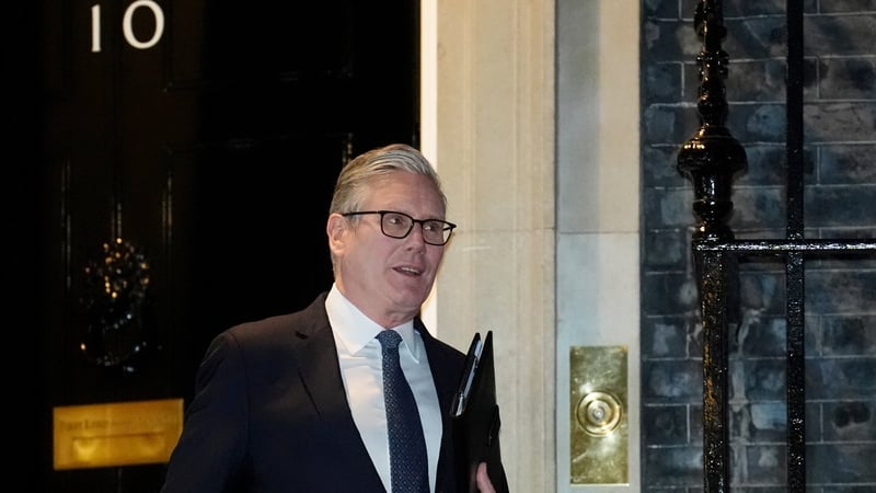 Keir Starmer holds a folder as he leaves 10 Downing Street