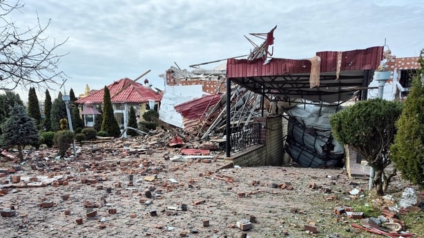 Rubble and debris lie in a yard of a residential house damaged by a Russian drone strike in Sloviansk, Ukraine