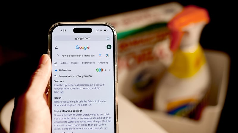 The Google Chrome AI Overview on a smartphone arranged in the Queens borough of New York, US, on Tuesday, Nov. 19, 2024. Top Justice Department antitrust officials have decided to ask a judge to force Alphabet Inc.'s Google to sell off its Chrome browser