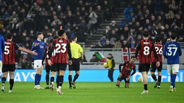 Referee Andrew Madley shows a red card to Jake O'Brien