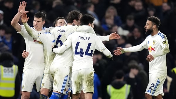 Leeds United players celebrate following the Premier League match at Stamford Bridge, London