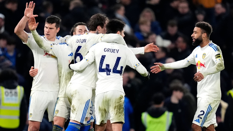 Leeds United players celebrate following the Premier League match at Stamford Bridge, London