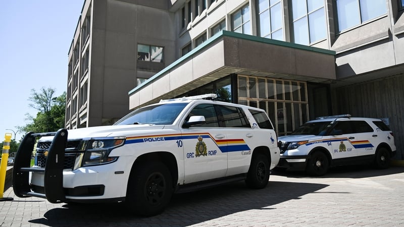 Police cars parked outside a building