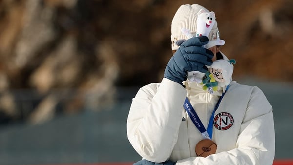 Sturla Holm Laegreid reacts on the podium