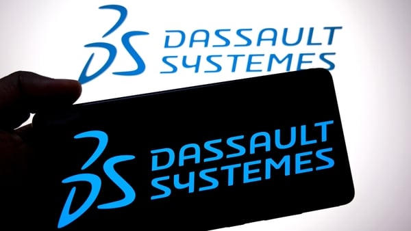 A Dassault Systemes logo displayed on a smartphone and in the background