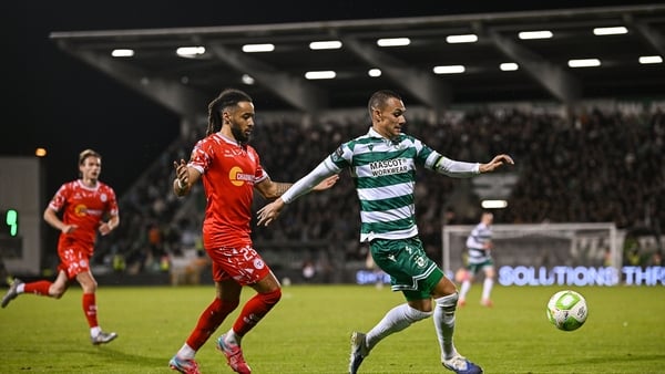 10 October 2025; Graham Burke of Shamrock Rovers in action against Milan Mbeng of Shelbourne during the SSE Airtricity Men's Premier Division match between Shamrock Rovers and Shelbourne at Tallaght Stadium in Dublin. Photo by Seb Daly/Sportsfile