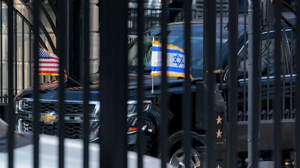 Israeli Prime Minister Benjamin Netanyahu travels from Blair House to the White House ahead of a meeting with Donald Trump