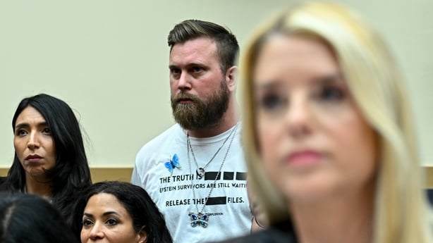 Sky Roberts, brother of Virginia Giuffre, centre, and his wife Amanda Roberts, left, stand behind Pam Bondi, US attorney general, during a House Judiciary Committee hearing in Washington