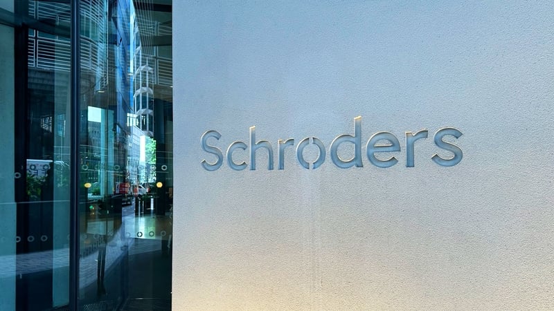 An office building with Schroders signage outside it