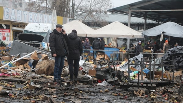 A man is seen talking on a phone as he views destruction following a Russian drone strike on a Odesa in Ukraine