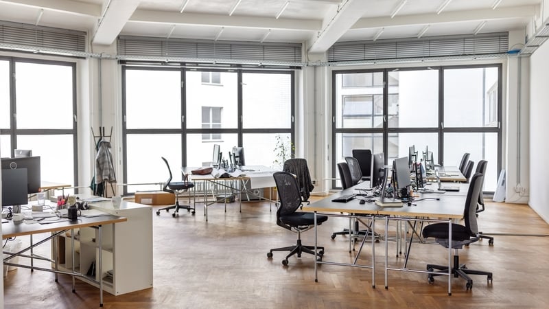 coworking desks at a creative office. Interior of an open plan office with no people.