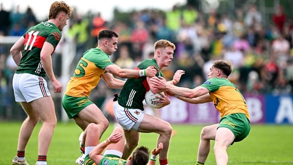 David McBrien of Mayo in action against Caolan McColgan, left, and Ciaran Thompson of Donegal - 2025 All-Ireland round robin