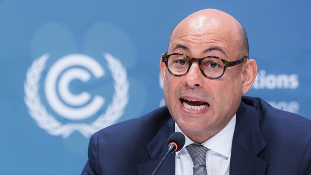 United Nations Climate Change Executive Secretary Simon Stiell speaks into a mic from a table in Turkey