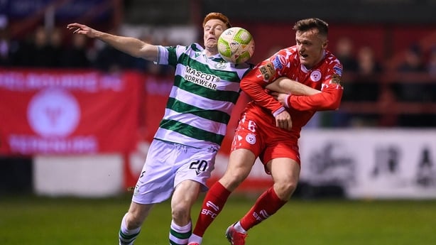 28 February 2025; Rory Gaffney of Shamrock Rovers is tackled by JJ Lunney of Shelbourne during the SSE Airtricity Men's Premier Division match between Shelbourne and Shamrock Rovers at Tolka Park in Dublin. Photo by Stephen McCarthy/Sportsfile
