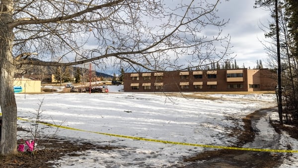 Police tape marks off Tumbler Ridge Secondary School where a mass shooting took place in the small town of Tumbler Ridge, British Columbia