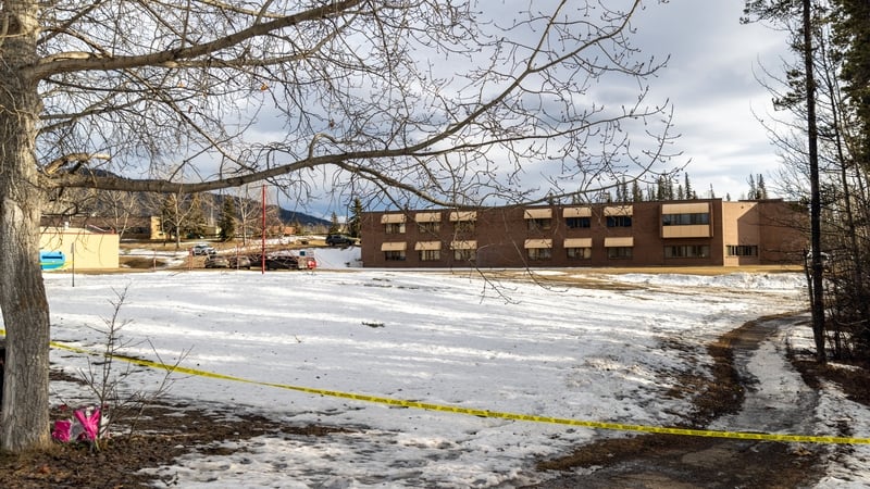 Police tape marks off Tumbler Ridge Secondary School where a mass shooting took place in the small town of Tumbler Ridge, British Columbia