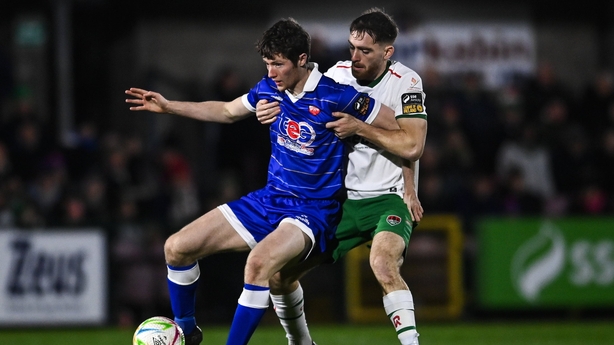 Ben Feeney of Treaty United (L) in action against Conor Drinan of Cork City, First Division, February 2026