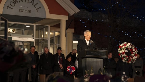 A man speaks into a microphone